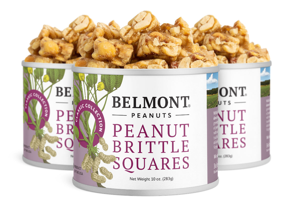 Three cans of Peanut Brittle Squares are filled to the top with bite-sized candy pieces. The labels include peanut illustrations and purple accents, making this sweet snack a perfect treat for any occasion.
