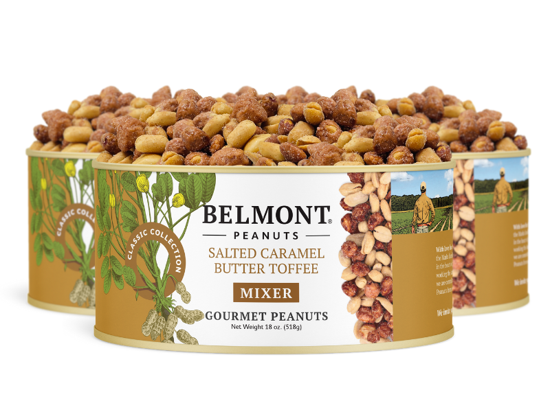 Three cans of Salted Caramel Butter Toffee Mixer, labeled "Mixer," are stacked together. The cans display images of peanuts, caramel pieces, and a vintage farm scene.