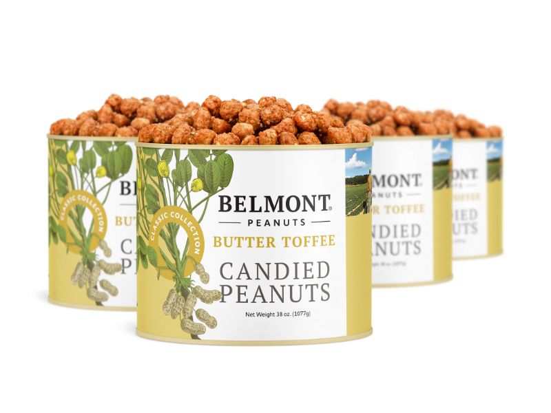 Four cans of Butter Toffee are showcased in a staggered row, with the front can in focus. Yellow labels hint at the irresistible buttery candy coating and sweet, nutty flavor inside.