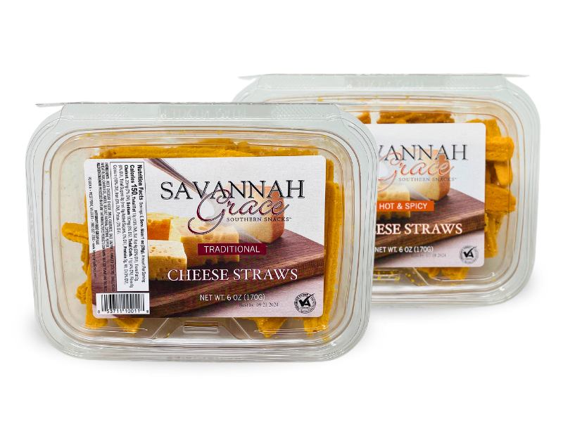 A clear plastic container of Savannah Grace Southern Snacks Traditional Cheese Straws, a savory cheddar cheese snack, with golden cheese pastries visible inside.