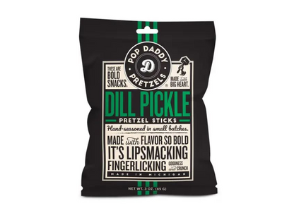 A black bag of Dill Pickle Pretzel Sticks features bold white and green text highlighting these hand-seasoned, zesty dill snacks as lip-smacking, finger-licking, and made in Michigan. Net weight: 3 oz.