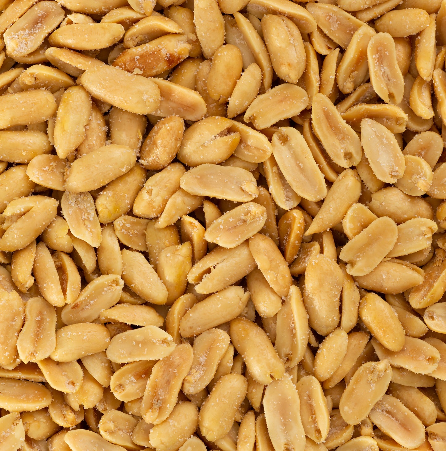 A close-up of Lemon Sea Salt Virginia Peanuts shows a pile of roasted peanuts with visible salt grains on their surface.
