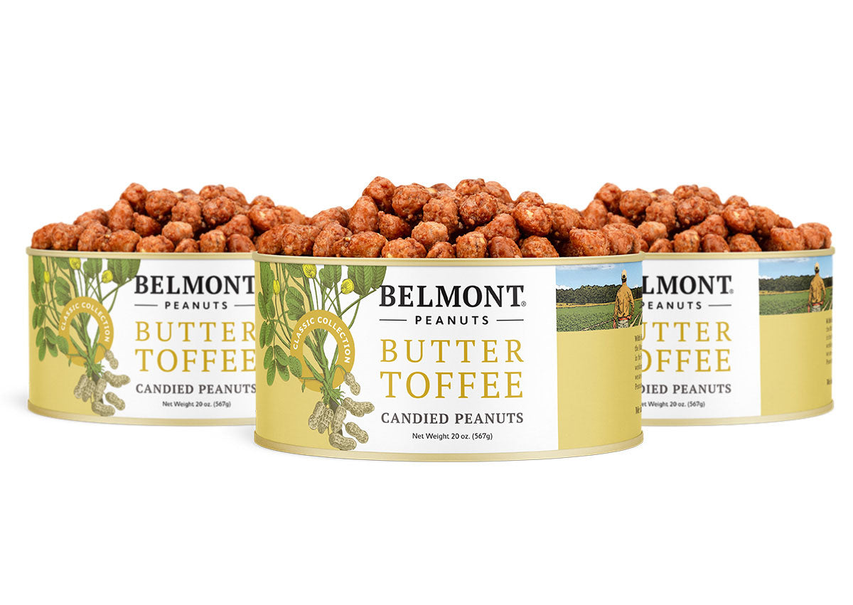 Three cans of Butter Toffee peanuts are displayed side by side, open and filled with candy-coated peanuts. The yellow labels have green illustrations and text.