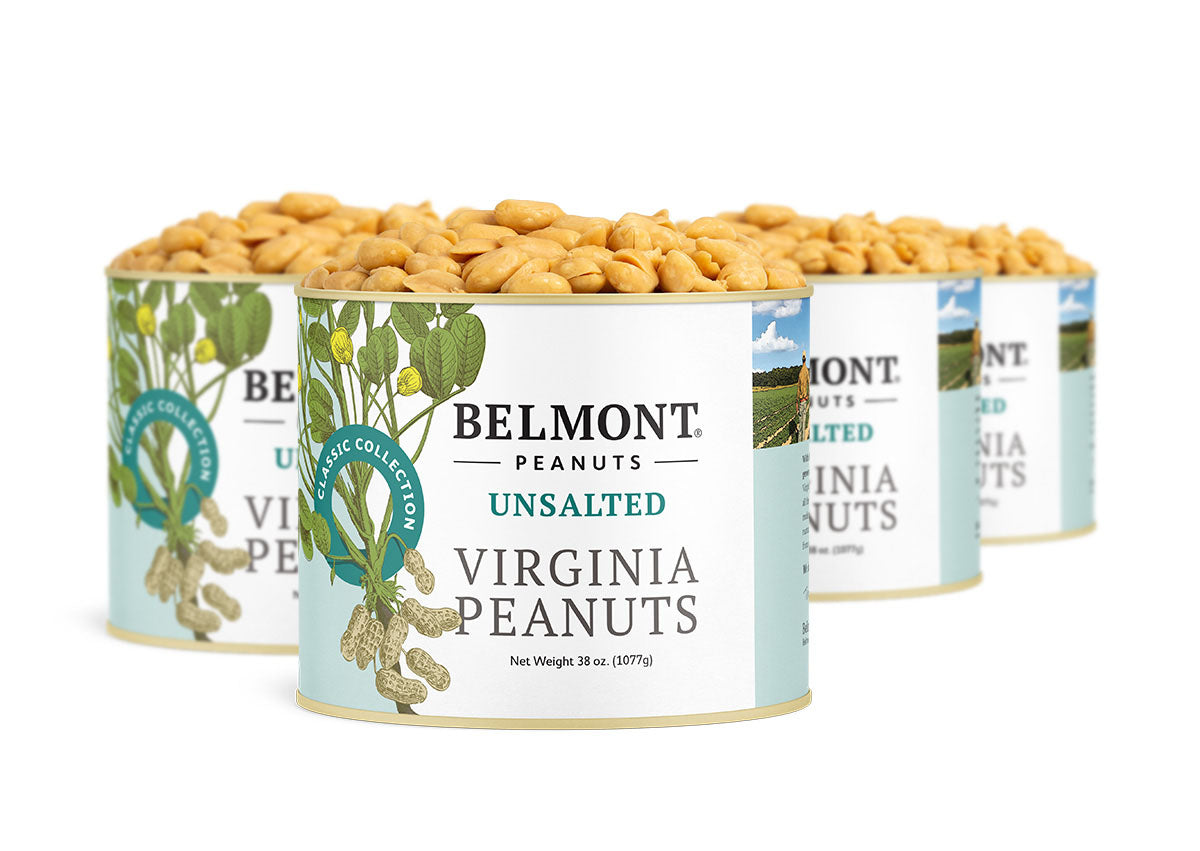 Four cans of Belmont Unsalted Virginia Peanuts are grouped together, overflowing with peanuts. The labels highlight "no salt added," making them ideal for those seeking pure, wholesome snacking.