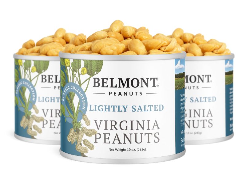 Three cans of Lightly Salted peanuts, each featuring images of peanuts and greenery, are shown close together. Every can contains 10 oz of deliciously crunchy, extra-large peanuts.