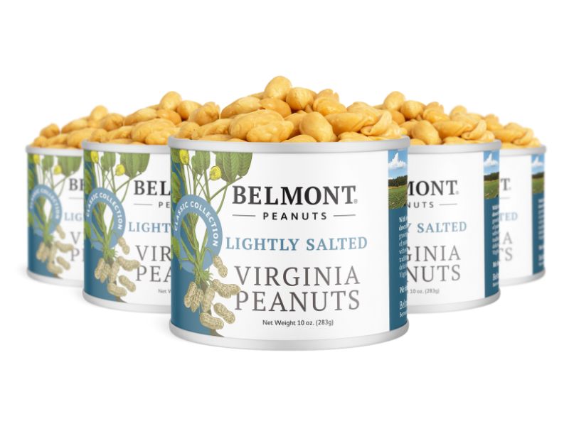 Four cans of Lightly Salted Virginia Peanuts, each filled with extra-large peanuts. The cans have white labels with green and blue accents plus peanut illustrations.