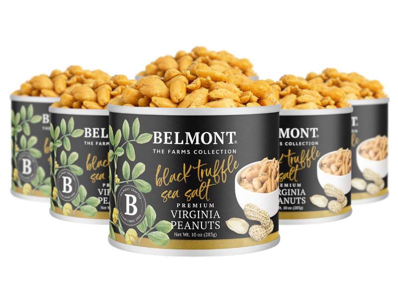 Five cans of Black Truffle Sea Salt are arranged in a semi-circle. The black cans feature images of peanuts and green leaves, highlighting the premium blend of Virginia peanuts with a hint of black truffle flavor.