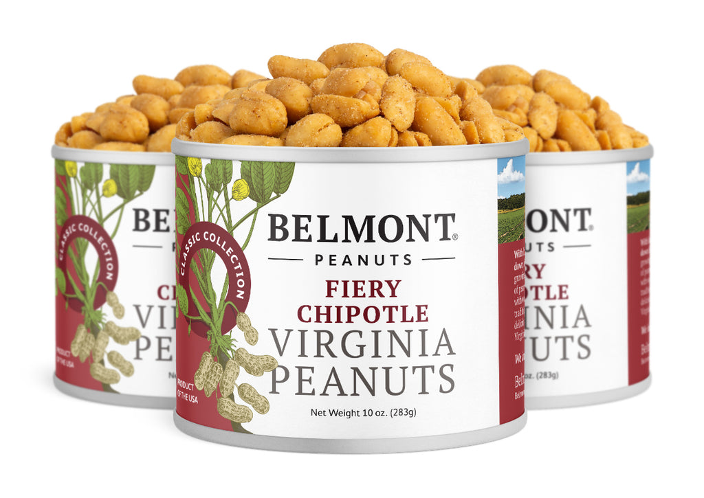 Three cans of Fiery Chipotle are grouped together, each featuring images of peanuts and green leaves, and filled with protein-packed snacks that deliver bold, seasoned flavor.