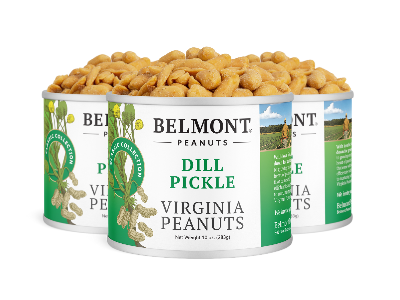Three cans of Belmont Peanuts Dill Pickle are displayed, filled to the top with seasoned peanuts. The white cans have green accents and a label featuring dill and peanuts.