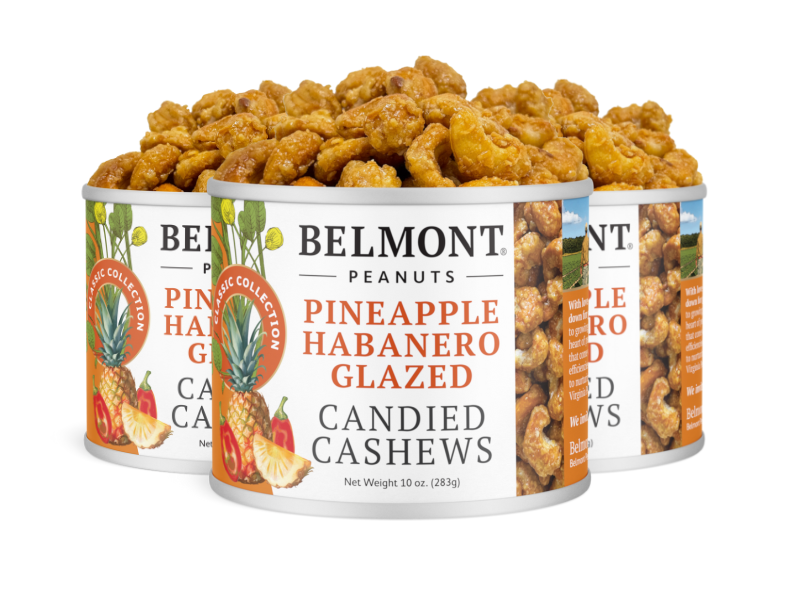Three cans of Pineapple Habanero Glazed Candied Cashews are filled to the top. The cans display images of pineapples, habanero peppers, and candied cashews, highlighting this spicy snack.