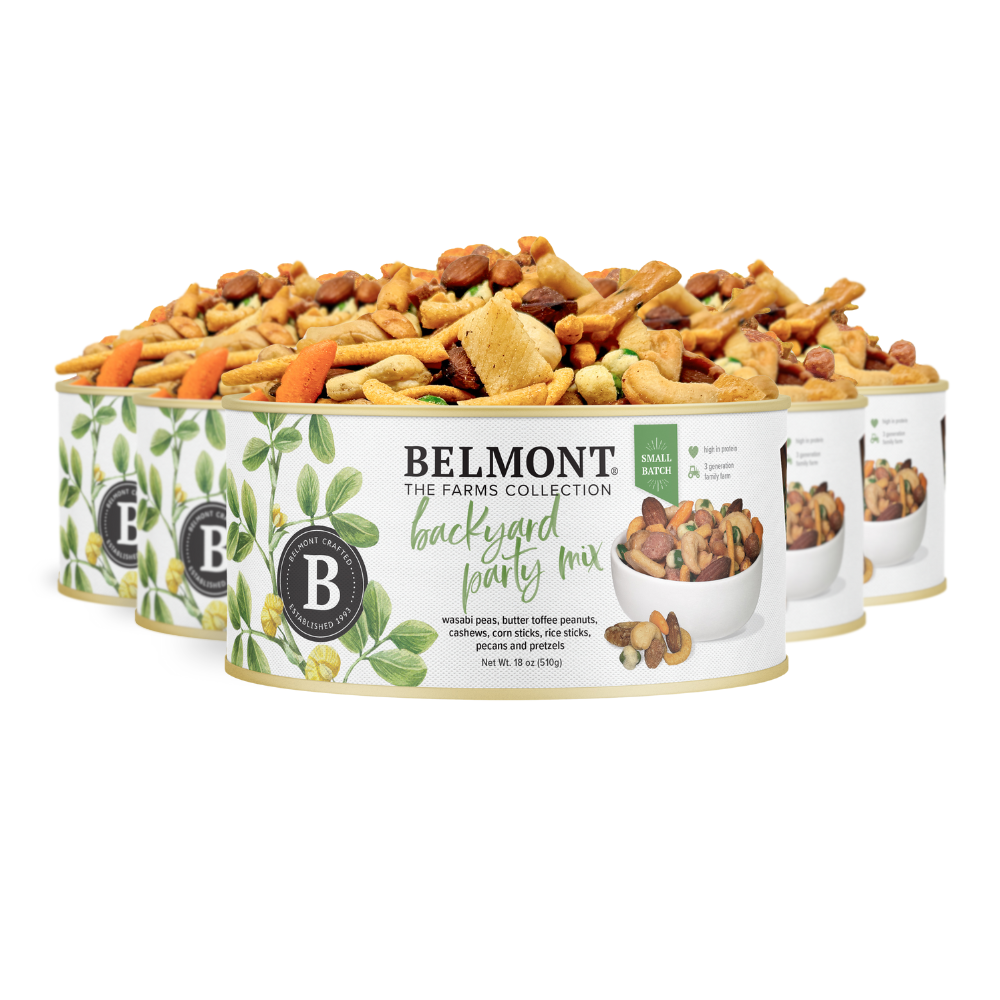 Four containers of Backyard Party Mix are stacked together. The packaging has leafy graphics and shows the mix, containing nuts, pretzels, Butter Toffee Candied Peanuts, and crunchy pieces.