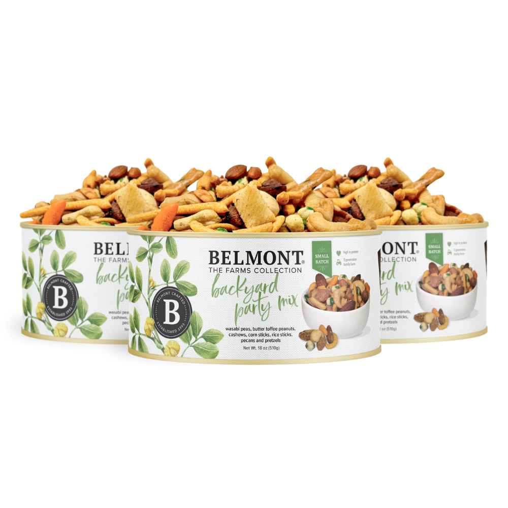 Three packs of Backyard Party Mix are lined up, each in leafy packaging that displays a photo of the snack featuring nuts, pretzels, crackers, and Butter Toffee Candied Peanuts.