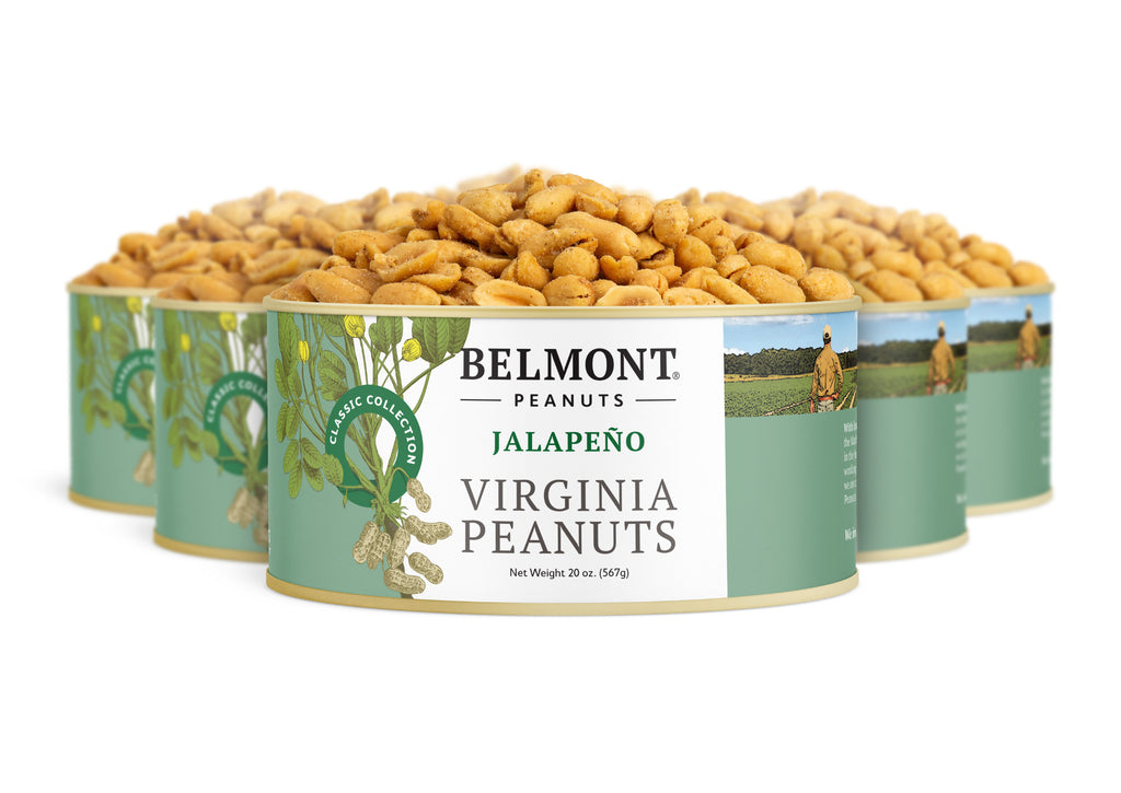 Four round containers of Belmont Peanuts Jalapeno are shown with green and white labels featuring peanut plants and a farmer. Each container is filled with perfectly roasted peanuts seasoned with a bold jalapeno flavor.
