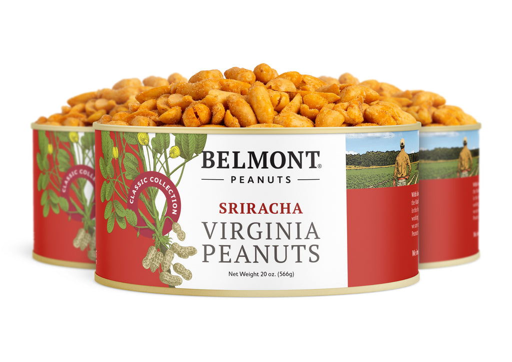 Three cans of Sriracha Virginia Peanuts, seasoned for a bold red chili kick. The eye-catching red label shows peanuts and a person in a peanut field.