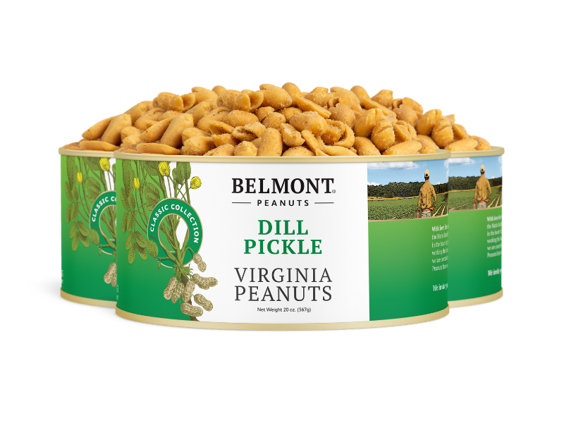 A tin of Dill Pickle flavored Virginia peanuts is shown in front, with two more tins behind it displaying green and white labels featuring peanut illustrations and text.