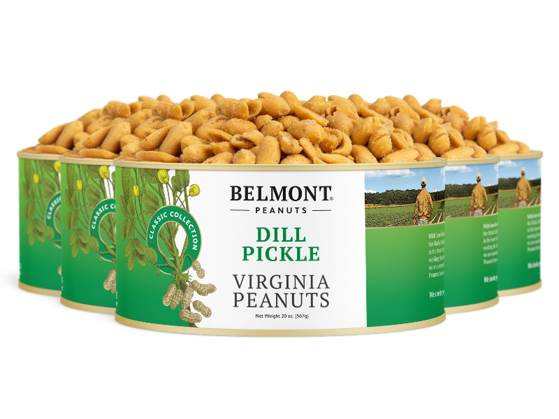 Five cans of Dill Pickle peanuts are arranged in a semi-circle, their green and white label showing peanut plants and a farmer, emphasizing the bold pickle flavor of these seasoned Virginia peanuts.