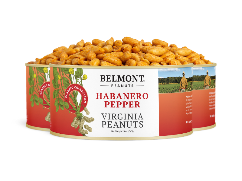 Three cans of Habanero Pepper peanuts are stacked, with spicy peanuts spilling from the top can. The labels feature images of peanuts and a farmer in a field.
