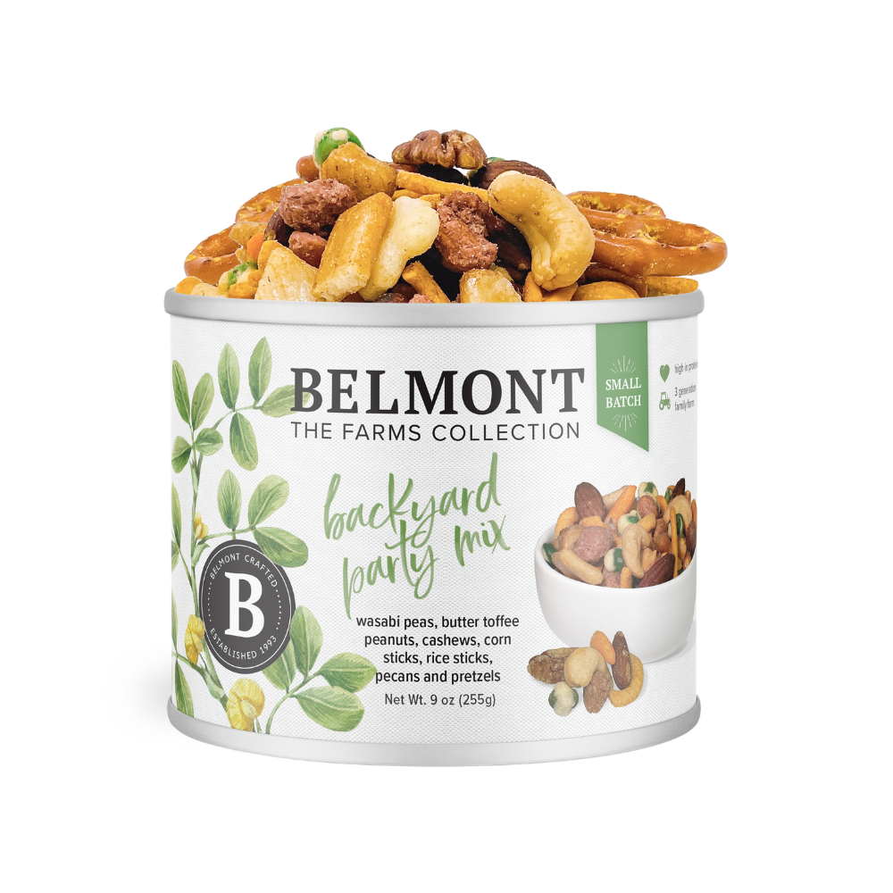 A can of Backyard Party Mix, packed with snacks such as pretzels, nuts, Butter Toffee Candied Peanuts, and wasabi peas, features a label with green botanical illustrations and detailed product info.