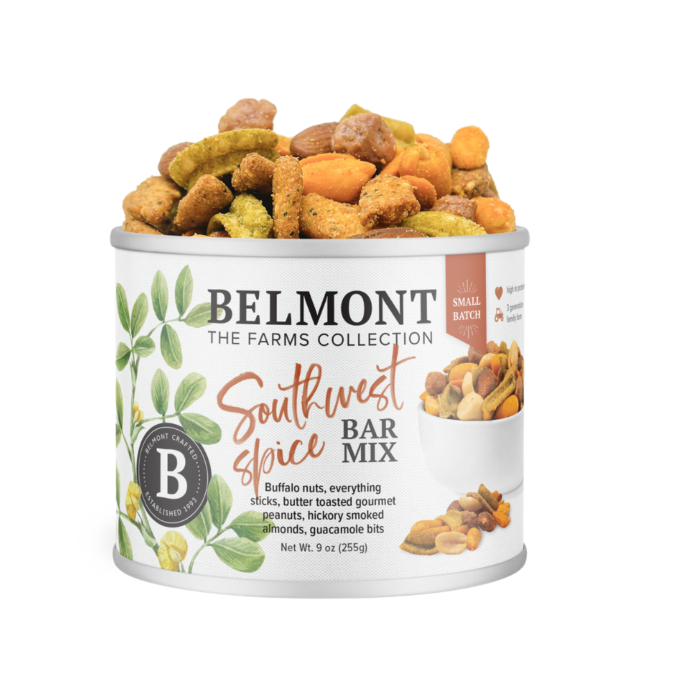 A canister of Southwest Spice Bar Mix, filled to the top with a vibrant blend of seasoned snacks like gourmet peanuts, pretzel sticks, guacamole bites, and hickory smoked almonds.