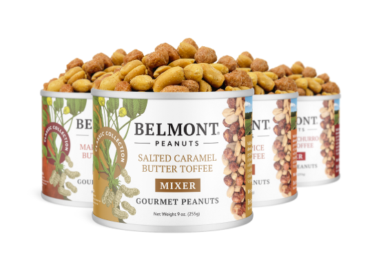 Three cans of the Butter Toffee Mixers Sampler Pack are shown, with the front can labeled Salted Caramel Butter Toffee Mixer. The sampler pack features a generous pile of coated gourmet peanuts on top.