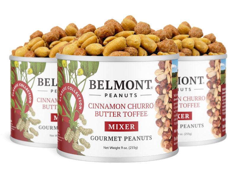 Three cans of Cinnamon Churro Butter Toffee Mixer, featuring a white label with peanut illustrations and the product name—ideal for fans of cinnamon and butter toffee peanuts.