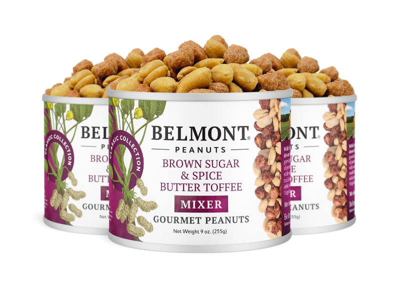 Three cans of Brown Sugar & Spice Butter Toffee Mixer peanuts, with candied peanuts overflowing from the tops. The cans are white with purple and nut-themed labels.