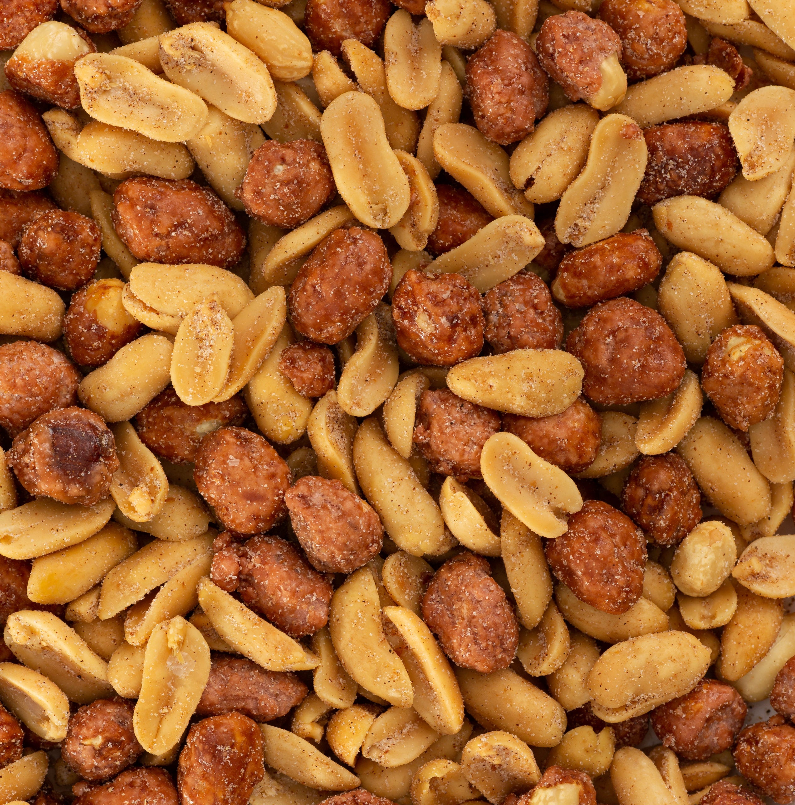 A close-up of the Butter Toffee Mixers Sampler Pack showcases salted and honey-roasted peanuts, featuring both smooth and sugar-coated textures.