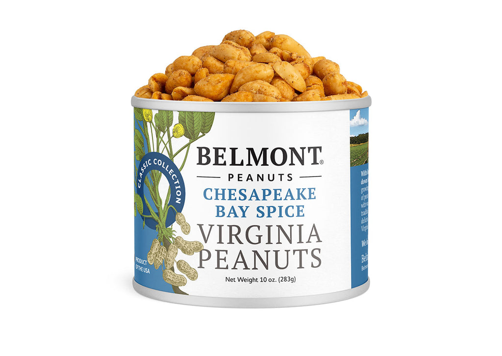 A can of Chesapeake Bay Spice peanuts, overflowing with seasoned Virginia peanuts. The label displays peanut plant illustrations and highlights the crab spice seasoning inside.