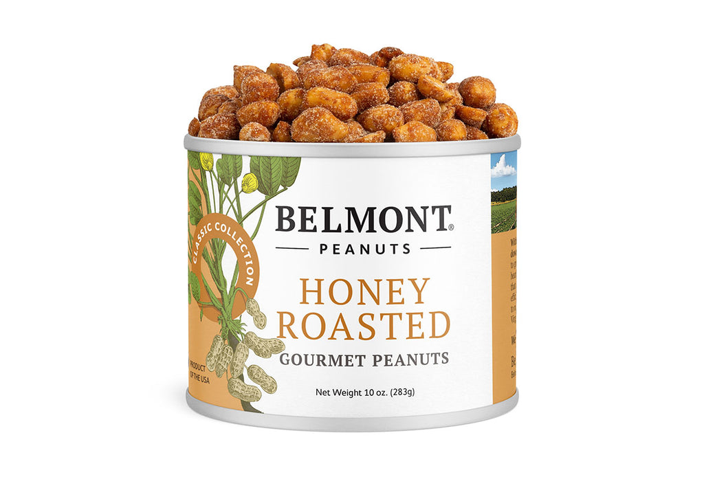 An open can of Honey Roasted peanuts reveals caramel-colored, sugar-coated jumbo peanuts inside. The label displays peanut plant illustrations and product details.